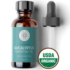 A brown glass bottle labeled "Organic Eucalyptus Oil, 1 fl oz" with 1 fl oz (30 ml) capacity is shown. The label is green with white text and a floral logo. A black dropper lies beside the bottle. A USDA Organic seal is displayed in the corner.