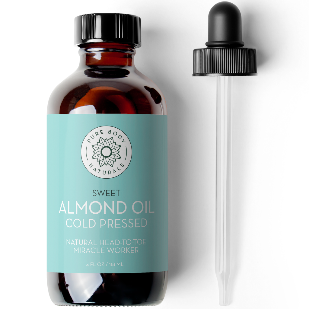 Bottle of Sweet Almond Oil Cold Pressed with dropper on a white background