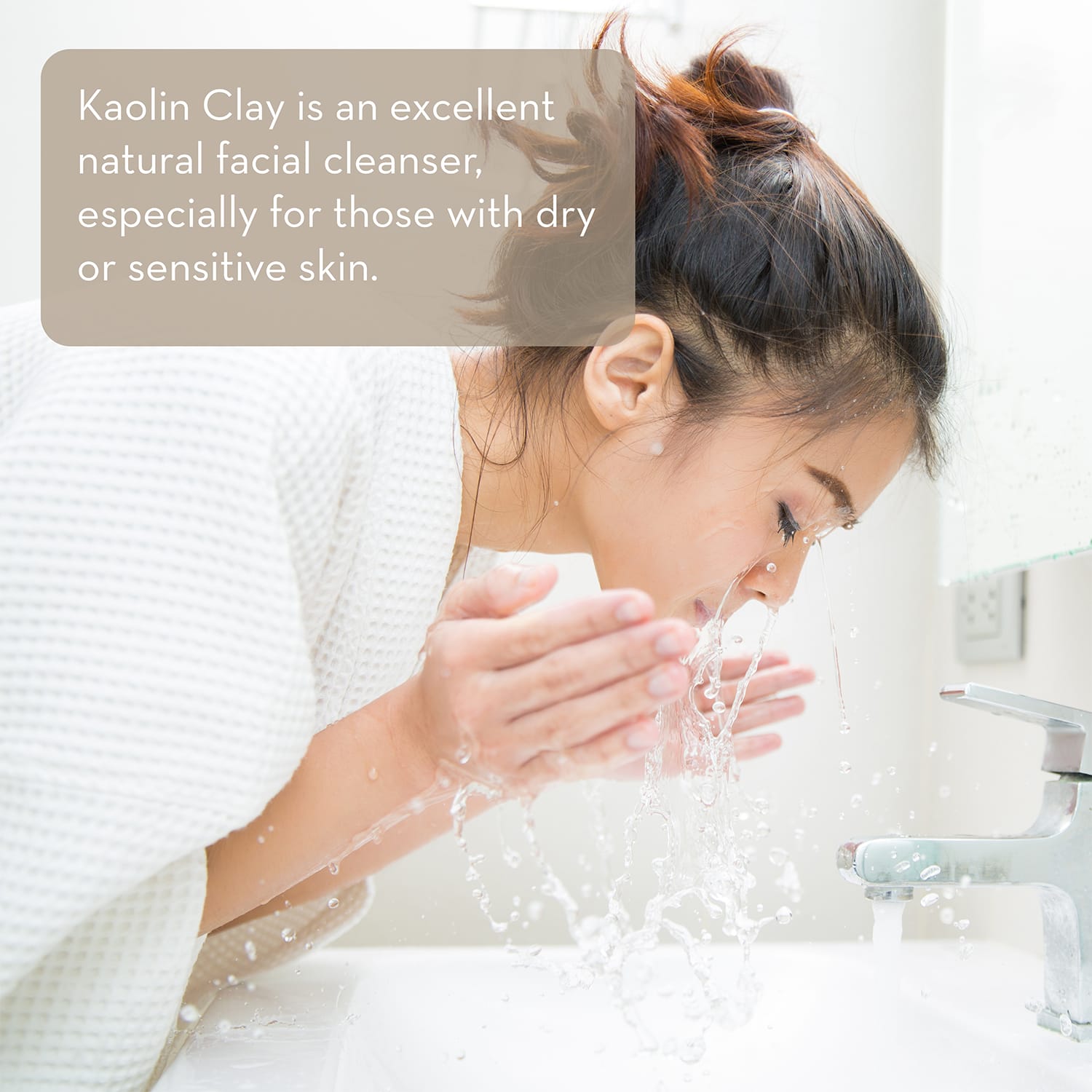 A woman with brown hair tied in a bun is washing her face with water at a sink. A rectangular text overlay on the top left reads, "Kaolin Clay Powder, 100 g is an excellent natural facial cleanser, especially for those with dry or sensitive skin.
