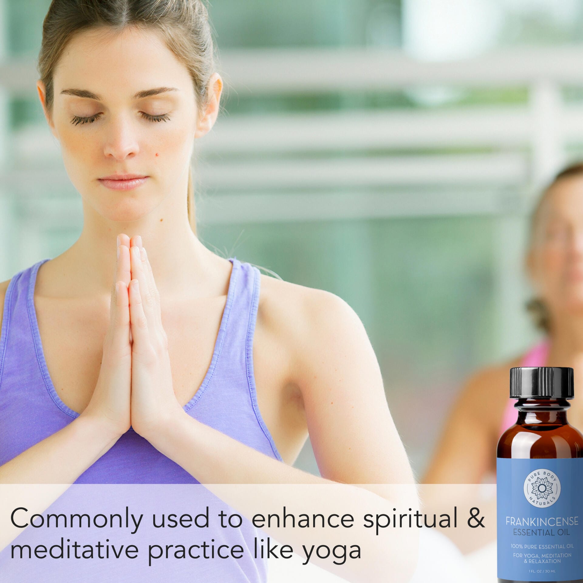 A woman in a purple tank top is sitting with her hands in a prayer position, eyes closed, in a meditative state. Beside her is a bottle of Frankincense Essential Oil, 1 fl oz with text stating its use for enhancing spiritual and meditative practices like yoga.