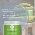 Tea tree oil foot and bath soak with green towels in the background