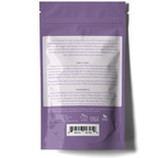 The back of a purple resealable pouch with white text detailing directions and ingredients for Recovery Ritual Sitz Bath Salt, 10 oz. The directions suggest how to use the soak, and the ingredients list includes Epsom salt, Dead Sea salt, and various organic oils. "Made in USA" and a barcode are visible.