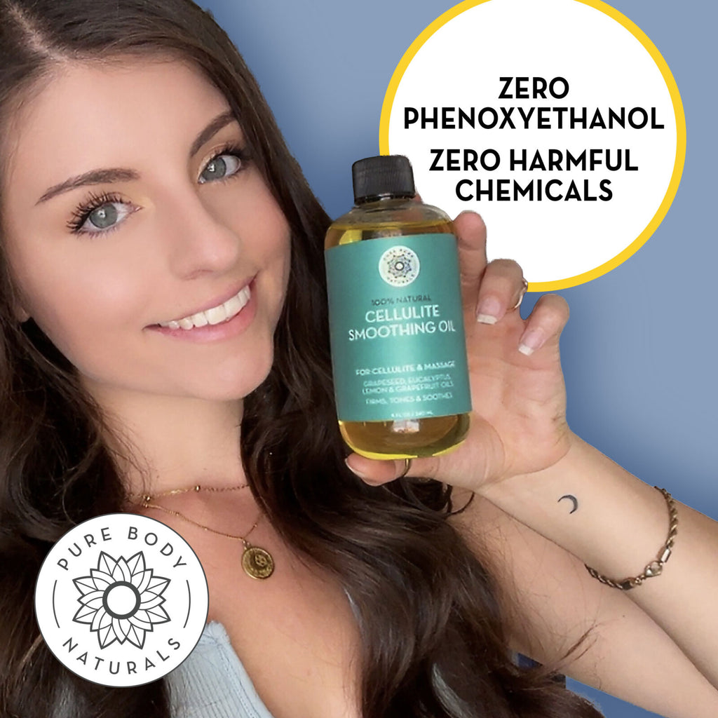 Woman holding a bottle of cellulite smoothing oil with text about zero harmful chemicals on a blue background.