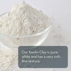 A close-up of a small glass bowl filled with pure white Kaolin Clay Powder, 100 g, with some clay scattered around the bowl. The image includes text that reads, "Our Kaolin Clay Powder, 100 g is pure white and has a very soft, fine texture.