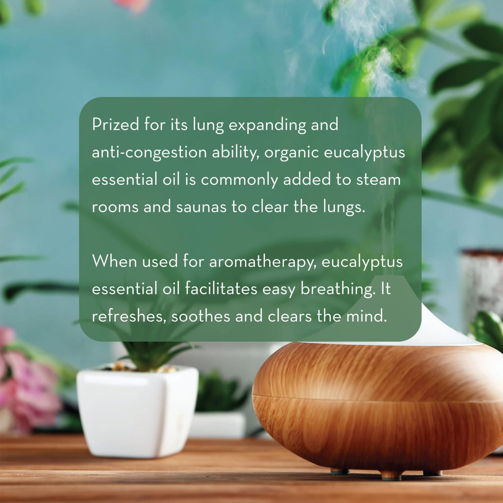 A wooden essential oil diffuser emits mist, placed on a wooden table near potted plants. Text reads: "Prized for its lung expanding and anti-congestion ability, Organic Eucalyptus Oil, 1 fl oz is commonly added to steam rooms and saunas to clear the lungs... clears the mind.