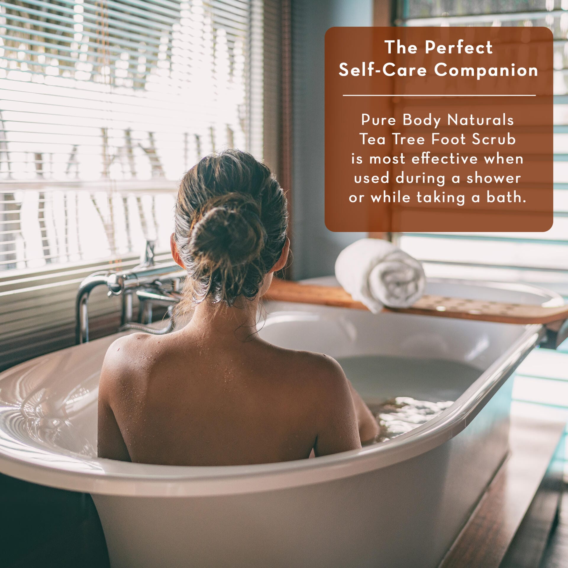 Person taking a bath with a text overlay about Pure Body Naturals Tea Tree Foot Scrub.