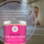 A jar of Himalayan Pink Salt Exfoliating Scrub is displayed with descriptive text highlighting its qualities: 99% natural ingredients, exfoliation and detox benefits, completely non-toxic, and cruelty-free. A woman is visible in the background in a bathroom setting.