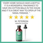 A review image for Peppermint Essential Oil, 4 fl oz with a 5-star rating. The review by M. Peterson reads: "Every home should have a bottle. It is a wonderful fragrance to have on cotton balls in the house and it is a great way to open up the nasal passage." Image shows the oil bottle and dropper.
