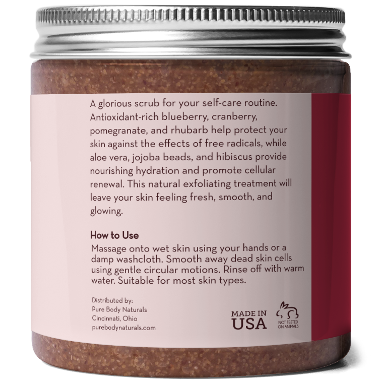 A jar of Superfruit Smoothie Scrub with a label that includes text on its benefits and usage instructions. The product features antioxidants from blueberry, cranberry, pomegranate, and rhubarb, and contains aloe vera, jojoba beads, and hibiscus. It is suitable for most skin types.