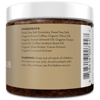 Jar of scrub with visible ingredients list and warning on a white background