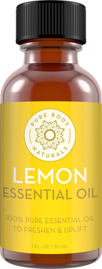 A 1 fl. oz (30 ml) amber glass bottle of Lemon Essential Oil. The bottle has a black screw-on cap and a yellow label with the text "Lemon Essential Oil" and "100% Pure Essential Oil to Freshen & Uplift.