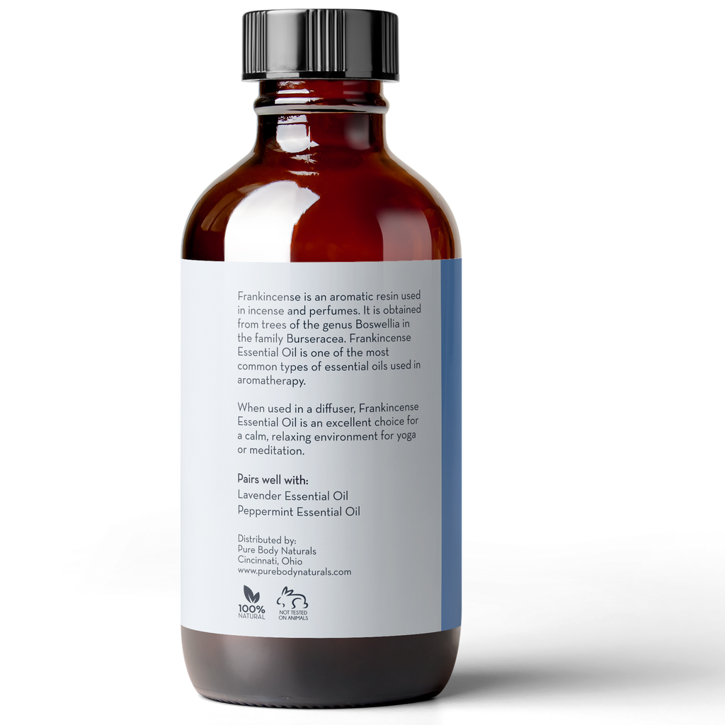 A brown glass bottle with a white label displays text describing Frankincense Essential Oil, 4 fl oz by Pure Body Naturals. The label includes usage information, pairing suggestions with Lavender and Peppermint oils, and distribution details from Cincinnati, Ohio.