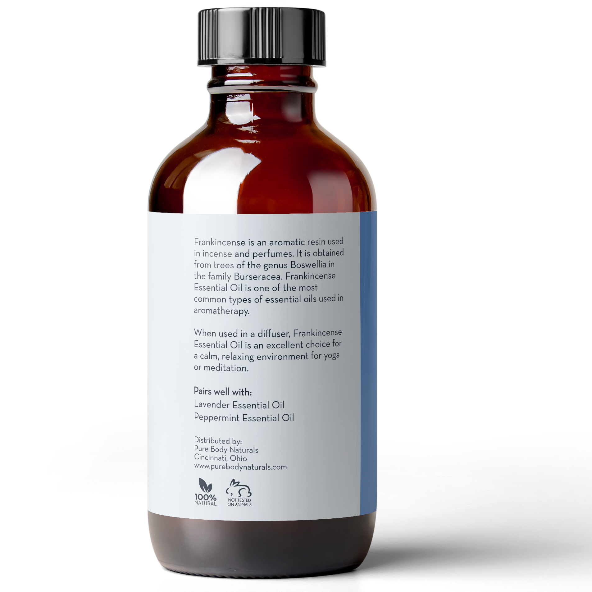A brown glass bottle with a white label displays text describing Frankincense Essential Oil, 4 fl oz by Pure Body Naturals. The label includes usage information, pairing suggestions with Lavender and Peppermint oils, and distribution details from Cincinnati, Ohio.