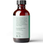 A brown bottle with a black cap labeled "Peppermint Essential Oil, 4 fl oz." The label describes its benefits such as increased energy, improved concentration, and allergy relief. The bottle is distributed by Pure Body Naturals, Cincinnati, Ohio.