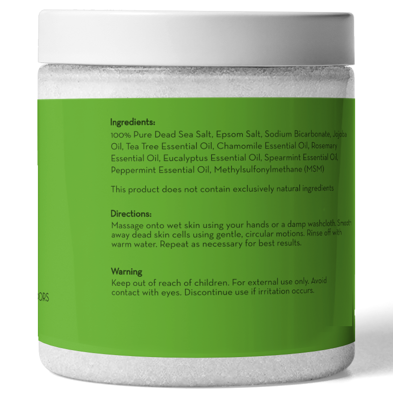 A white plastic jar with a green label lists the ingredients and directions for use of Tea Tree Oil Body and Foot Scrub. Ingredients include various essential oils and salts. Directions advise massaging onto wet skin and rinsing. It also includes a warning to keep out of reach of children.