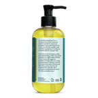 Bottle of oil with a pump and label on a white background