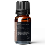 A small dark amber bottle of Clove Essential Oil, 10 ml with a black cap. The label provides details such as ingredients, extraction method (steam distillation), and safety information. The bottle has a capacity of 10 ml (0.33 fl oz).