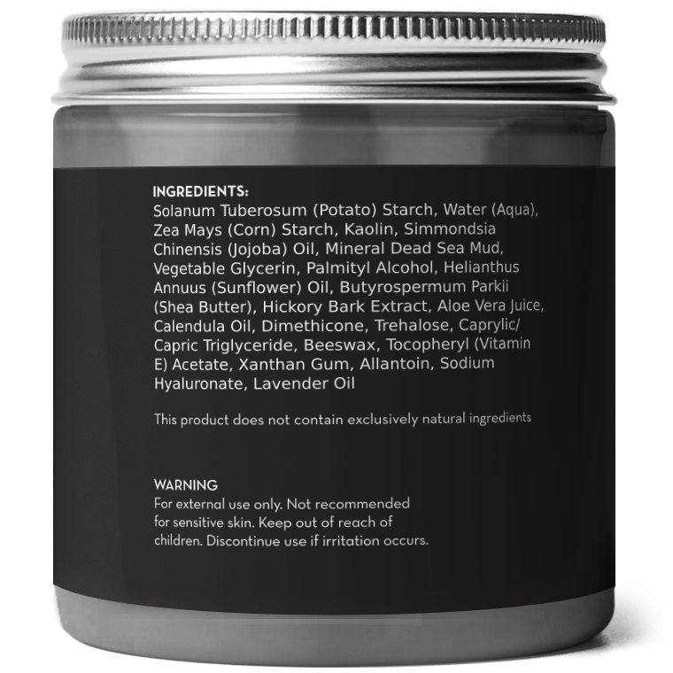 A dark grey cosmetic container with a silver lid displays a list of ingredients and a warning. Ingredients include potato starch, corn starch, kaolin, jojoba oil, and lavender oil. The warning advises external use only and to discontinue use if irritation occurs on the Dead Sea Mud Mask.
