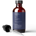 A brown glass bottle with a dropper beside it. The bottle's label lists ingredients, origin (Vietnam), extraction method (cold pressed), aroma description (earthy, nutty, resembling lime curry), and a warning to keep out of reach of children. The product name is Cold Pressed Tamanu Oil.