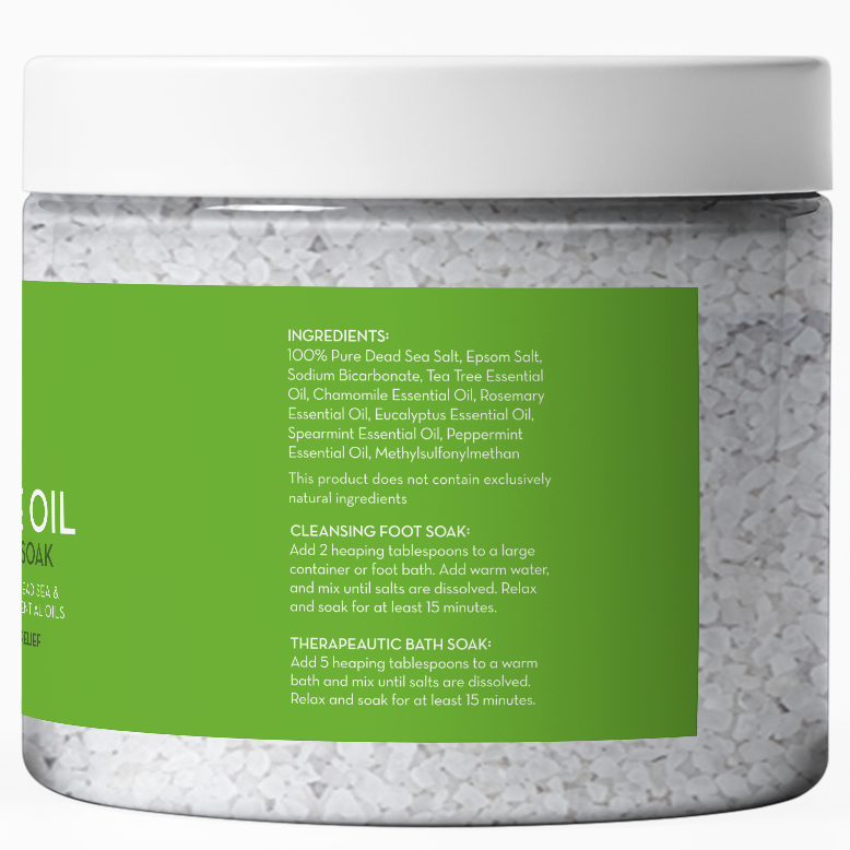 A white jar of Epsom Salt Foot Soak with Tea Tree Oil with a label on the back showing the ingredients and instructions for use. The ingredients include various essential oils such as tea tree and eucalyptus. Instructions are provided for both a cleansing foot soak and a therapeutic bath soak.