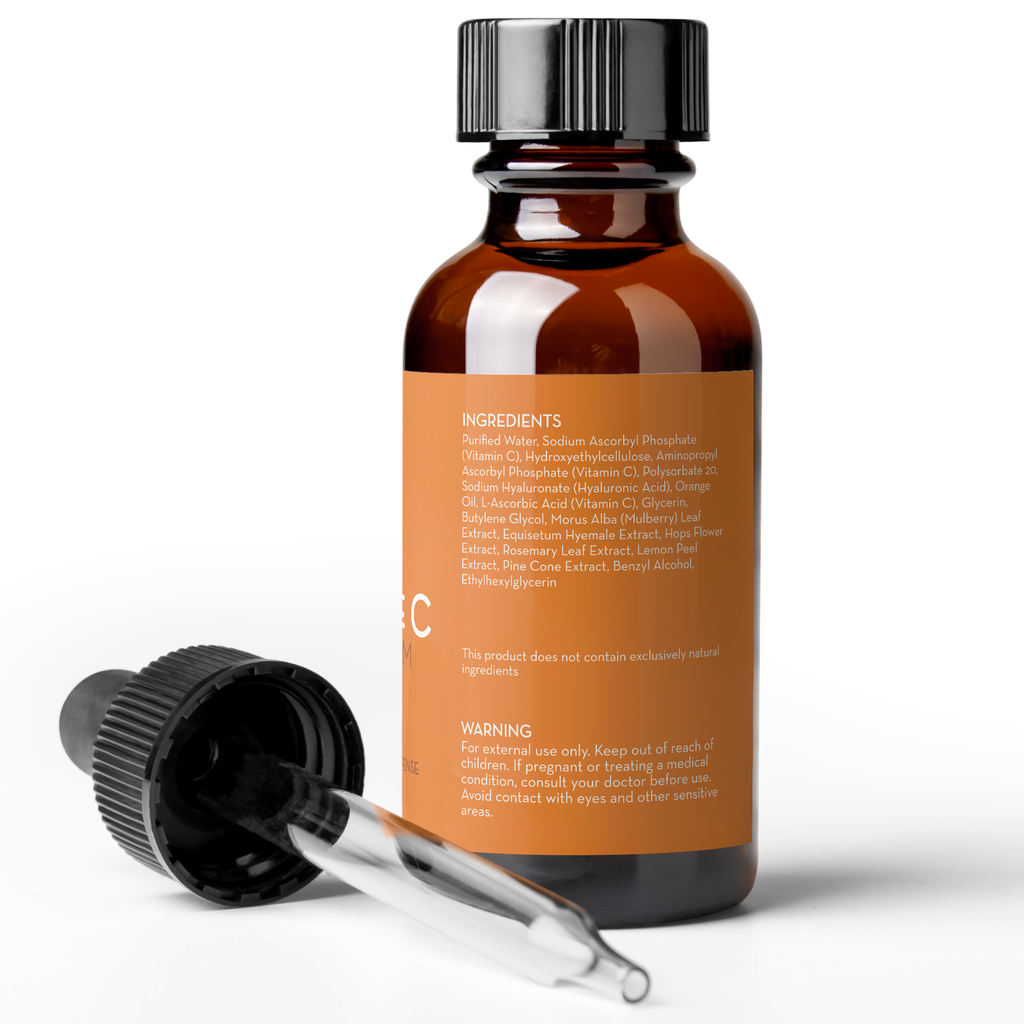 Amber glass serum bottle with dropper, showing ingredients and warning label on the back.