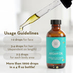Bottle of argan oil with a dropper and usage guidelines on a white background