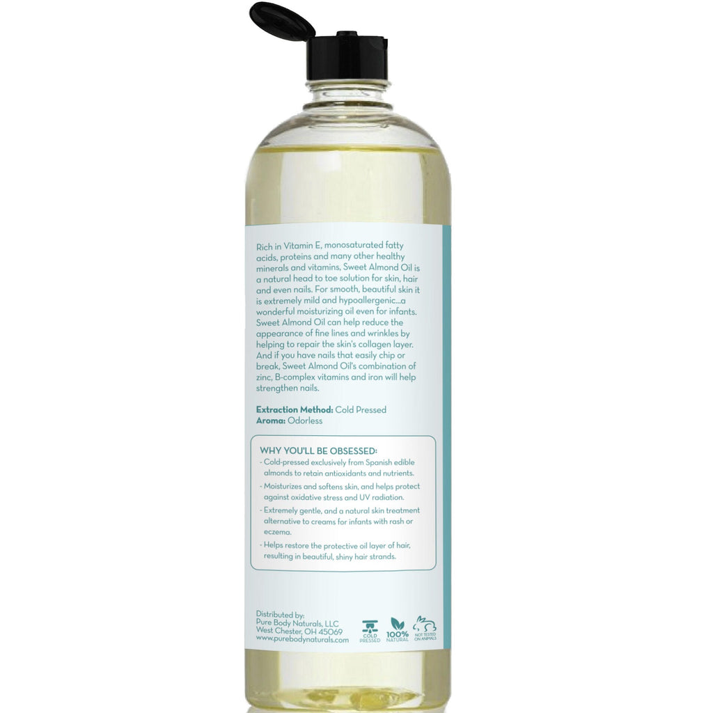 A clear bottle with a black flip-top cap contains a light yellow liquid. The label on the back highlights the benefits of Cold Pressed Sweet Almond Oil, rich in Vitamin E, promoting healthy skin and hair, and providing deeply moisturizing properties.