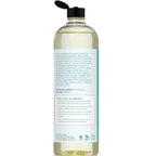 A clear bottle with a black flip-top cap contains a light yellow liquid. The label on the back highlights the benefits of Cold Pressed Sweet Almond Oil, rich in Vitamin E, promoting healthy skin and hair, and providing deeply moisturizing properties.