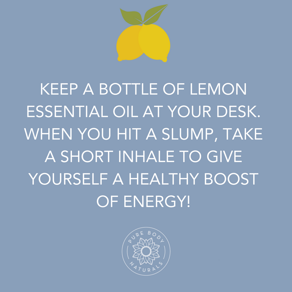 An image with a blue background featuring the text: "Keep a bottle of Lemon Essential Oil at your desk. When you hit a slump, take a short inhale to give yourself a healthy boost of energy!" At the top, there are two yellow lemons with leaves. A logo at the bottom says "Pure Body Naturals.