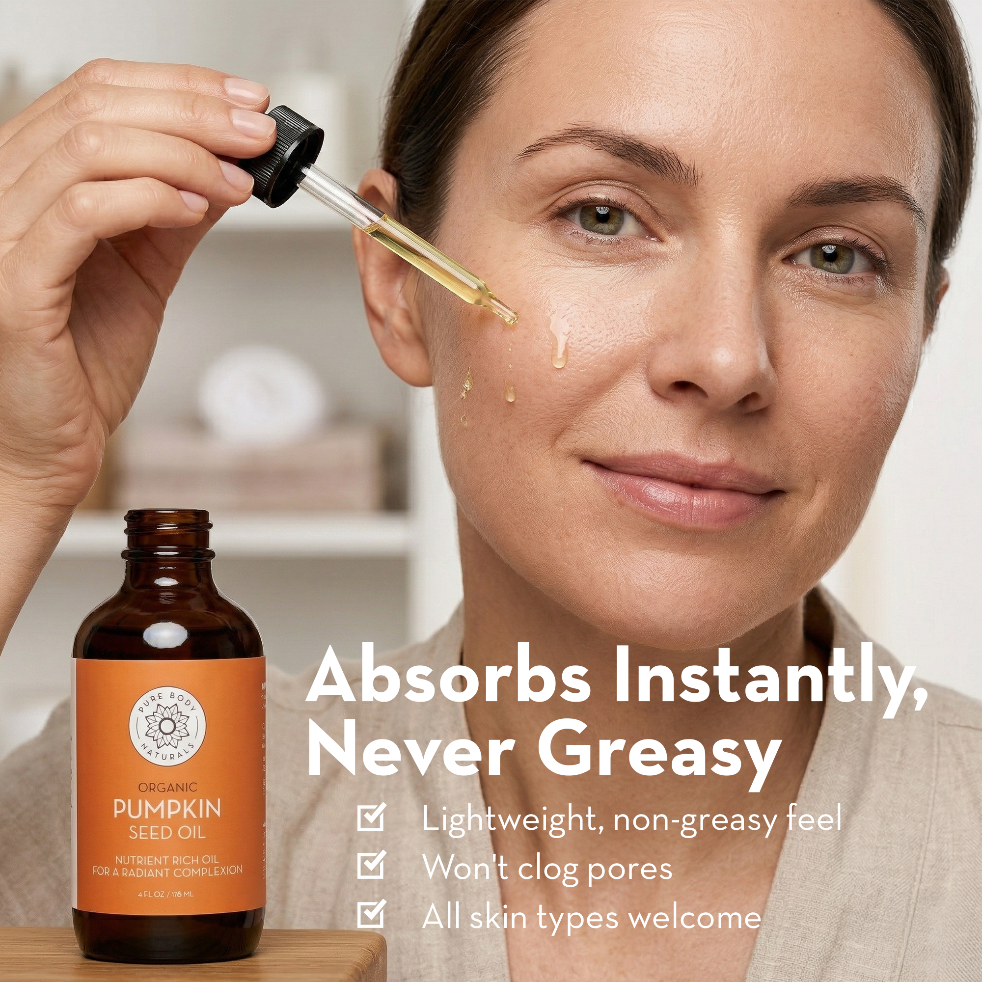 Woman applying pumpkin seed oil to her face with a dropper, next to a bottle of the product.