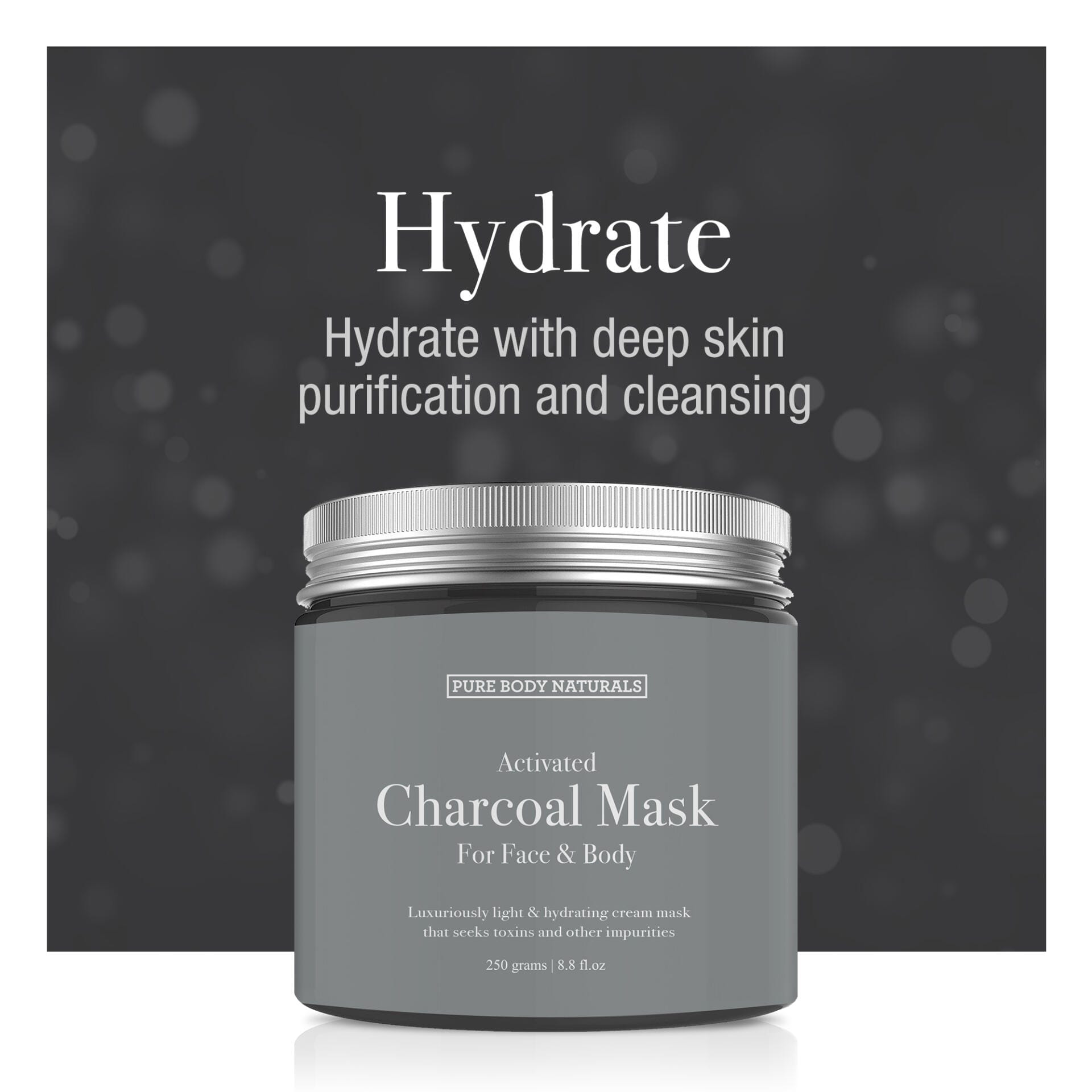 Gray jar of activated charcoal mask with silver lid on a dark background